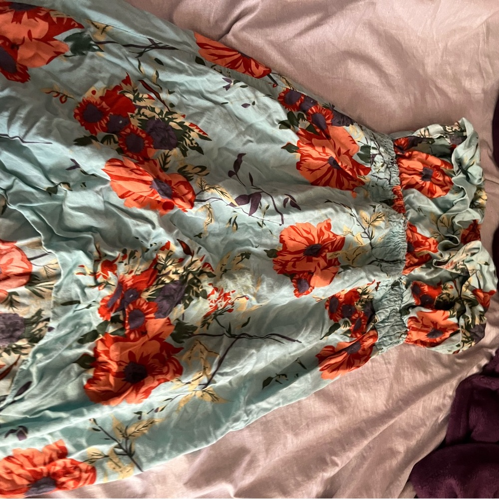 Teal strapless dress with flowers.